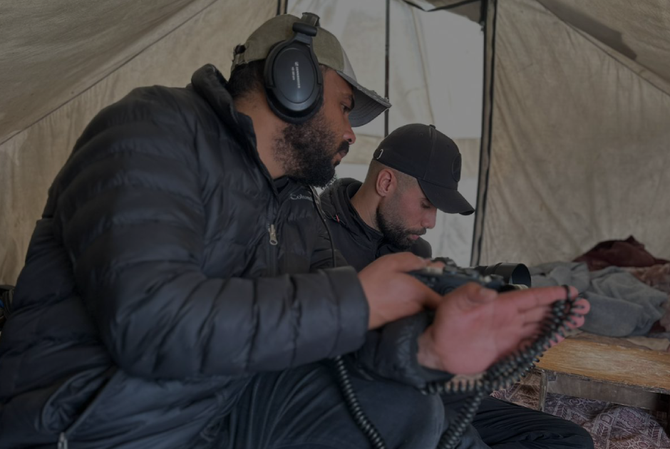 Sound recordist at work inside the tent