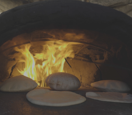 Bread baking in a clay oven